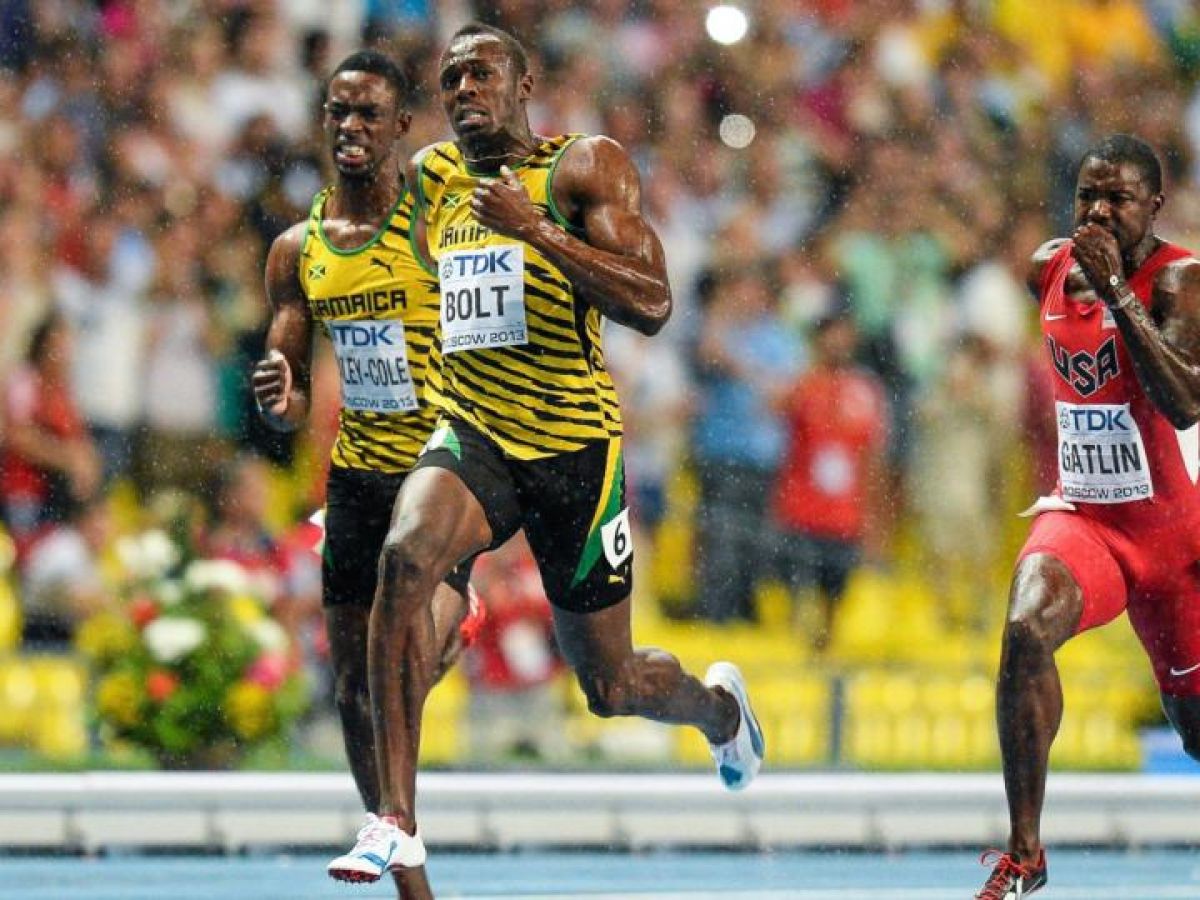 Usain Bolt Runs Through The Rain And The Field To Finish On Top Of The World