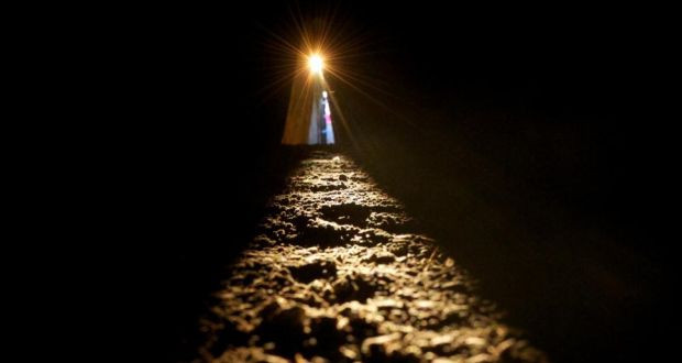 The sun shines along the passage floor into the inner chamber at Newgrange during the  Winter Solstice today. The passage tomb in Co. Meath was built over 5,000 years ago. Photograph: Alan Betson/The Irish Times. 