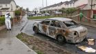 A burned out car is seen in the Earlsfort estate in Lucan, which gardai suspect mayb have been used in a fatal shooting in Abbeywood Court, Lucan, in Co Dublin. Photograph: Collins 