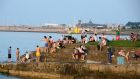 It was the brightest month for Dublin in almost three decades, as Dublin Airport station recorded its lowest number of dull days since 1990. Pictured are people enjoying the hot weather at Seapoint in Dublin last month. Photograph: Dave Meehan/The Irish Times