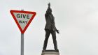Sir Edward Carson’s statue seen behind a road sign at Stormont on Thursday in Belfast. A political crisis has erupted following the murder of Kevin McGuigan  last month. Photograph: Getty 