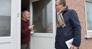Fianna Fáil’s John Lahart canvassing local resident PJ Carroll for a vote in the Greenhills area of Dublin. Photograph: Alan Betson 