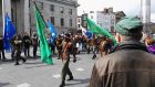 A paramilitary colour party marches down O’Connell Street as part of the Republican Sinn Féin 1916 parade, opposite the GPO, April 23rd, 2016. 