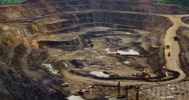 Excavators and drillers at work in an open pit at Tenke Fungurume, a copper and cobalt mine in the Democratic Republic of Congo