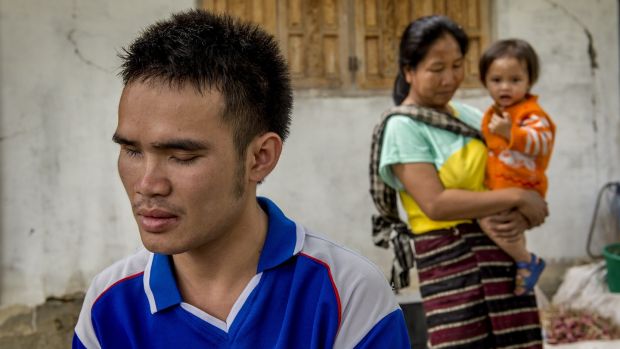 Khammeung Phommalein, aged 25, at his home in the Kham district of Phonsavan, Laos. Khammeung was blinded by a UXO when he brought it home and it exploded. Photograph: Brenda Fitzsimons