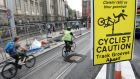 Caution signs at  the Luas track on  College Green, Dublin. Photograph: Dara Mac Dónaill/The Irish Times