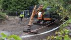 Gardaí and excavation workers at the scene of the search for the body of Trevor Deely in Chapelizod, Co Dublin on Monday morning. Photograph: Colin Keegan/ Collins Dublin