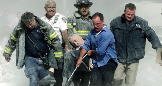 Image result for Rescue workers carry fatally injured New York City Fire Department Chaplain Father Mychal Judge from one of the World Trade Center towers in New York City, early Sept. 11, 2001.