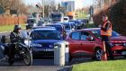  Motorists queue to fill up at  a petrol station in  Tallaght in Dublin which was   selling fuel for 99 cent per litre for 99 minutes as part of a Black Friday promotion. Photograph: Collins 