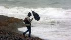 Hardy walkers brave the rain and wind at the seafront in Bray, Co Wicklow. Photograph: John Cogill 