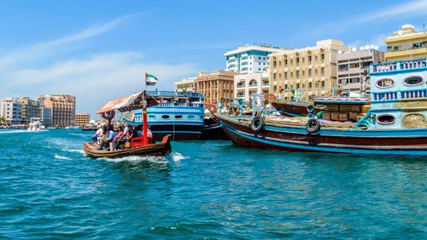 Welcome To My Place Dubai - crossing dubai creek in an abra boat photograph getty images