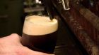 Pouring a pint of Guinness: the two-part pour is a cod. Photograph: Dara MacDonaill