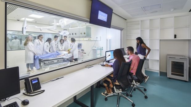 RCSI medical students during a simulated training exercise in a mock operating theatre control room, in its new building on York Street