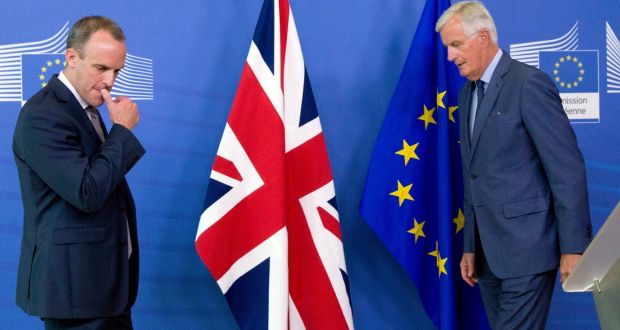 Britain’s Secretary of State for Exiting the European Union Dominic Raab, left, and EU chief Brexit negotiator Michel Barnier prepare to shake hands after a media conference at EU headquarters in Brussels. Photograph: Virginia Mayo/AP