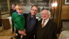 Myles Kelly (2), Maxim Kelly (38) and President Michael D Higgins at the homecoming in Galway on Sunday night. 
