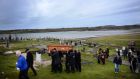  The remains of Pascal Whelan are brought across the sands at low tide to Omey Island.  He was the last permanent resident of Omey. Photograph: Bryan O’Brien / The Irish Times