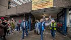 Volunteers leaving Apollo House in January 2017. Photograph: Brenda Fitzsimons/ The Irish Times