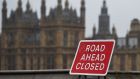 A road sign  on Westminster Bridge in London. Photograph: EPA/Andy Rain