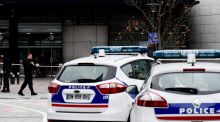 Forensic police in front of the main entrance of the Pôle Universitaire Léonard-de-Vinci where a 66-year-old teacher from Ireland was stabbed to death. Photograph: Philippe Lopez/AFP/Getty Images