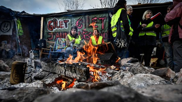 Yellow vest (Gilets Jaunes) protestors occupy a traffic circle, on December 11th in Saint-Etienne. Photograph: AFP/Getty Images