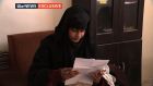 Shamima Begum (19) in a Syrian refugee camp reading a copy of the UK home office letter stripping her of British citizenship. Photograph: ITV News/PA Wire