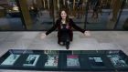 Moya Brennan pictured with six U2 album covers that are part of the new vinyl walkway  on Windmill Lane in Dublin. Photograph: Laura Hutton/The Irish Times 