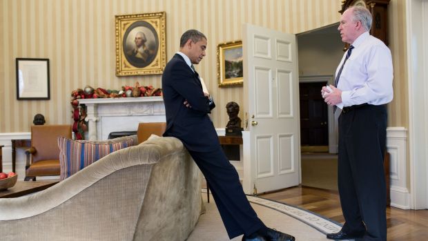 December 2014: President Barack Obama reacts as John Brennan briefs him on the details of the shootings at Sandy Hook Elementary School. Photograph: Pete Souza/The White House via Getty Images