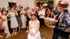 Lisa McNamee: A rose crown was placed on the bride’s head, and she was seated in the centre of a large circle. 