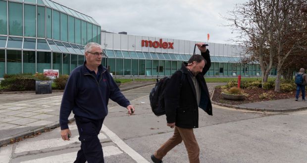 Staff leaving at Molex plant in Shannon on Tuesday. Its impending closure was “a global decision made on the basis that 75 per cent of the product they manufacture in the Shannon plant is at end of life”. Photograph: Eamon Ward