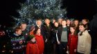 President Michael D Higgins and his wife Sabina switch on the lights on the Christmas Tree at  Áras an Uachtaráin in Dublin on Saturday evening.  Photograph: Dara Mac Dónaill