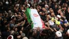 Mourners in Tehran carry the casket of Iranian military commander Qassem Suleimani. Photograph: AFP via Getty Images