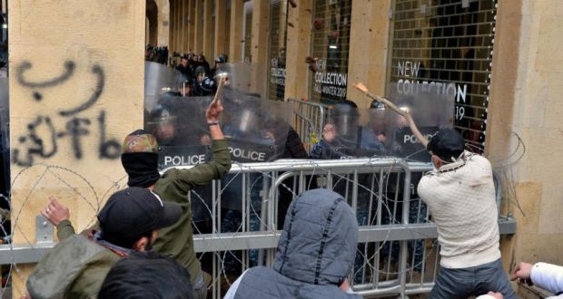 Anti-government protesters clash with Lebanese riot police during a protest outside of the parliament in downtown Beirut on January 18th. Photograph: Wael Hamzeh/EPA