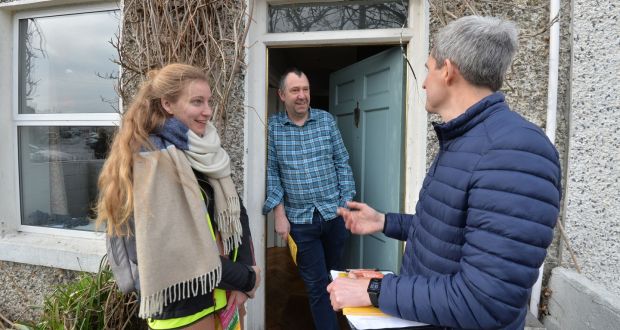  Liberties resident Colin Martin gives a hearing to  Lana Bruens and Shane Roberts of climate action groups Extinction Rebellion and One Future during a joint canvass  in the area. Photograph: Alan Betson 