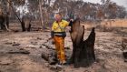 James Fitzgerald, director of the Two Thumbs Wildlife Trust,  inspects his bushfire-scorched koala reserve on earlier this month in Peak View, Australia. Photogrpah: John Moore/Getty Images
