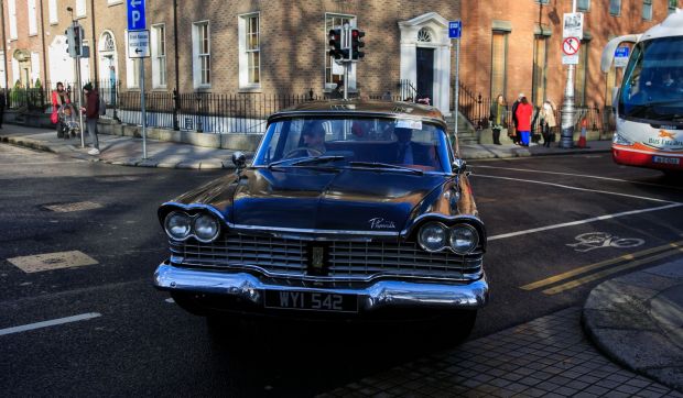 Limerick TD Richard O’Donoghue arrives at the 1st meeting of the 33rd Dáil at Leinster House in a 1953 Plymouth car. Photograph: Gareth Chaney/Collins