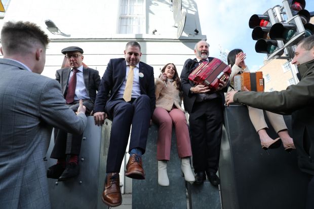 Marking their arrival at the Dáil with a sing-a-long (from left): Michael Healy-Rae, Johnny Healy-Rae, Elaine Healy-Rae, Danny Healy-Rae and Maura Healy-Rae on Kildare Street. Photograph: Nick Bradshaw/The Irish Times