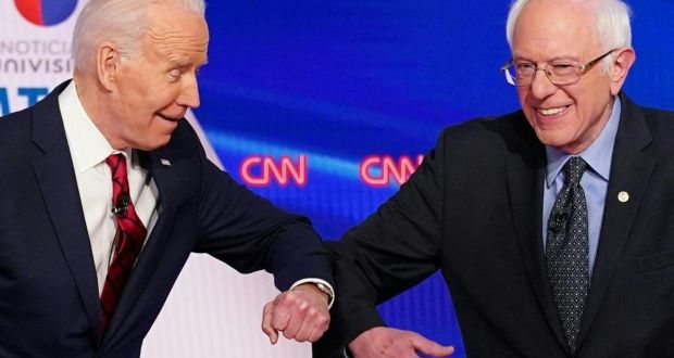 Democratic hopefuls bump elbows and lock horns at first one-on-one debate