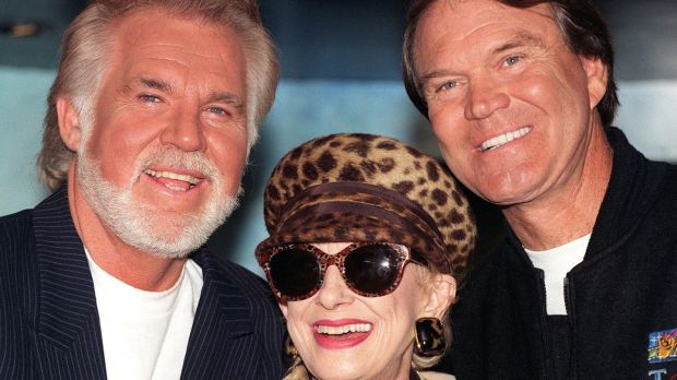 Veteran Country and Western singers (L-R) Kenny Rogers, Tammy Wynette and Glen Campbell in central London in 1996 for a news cinference to launch their Unforgettable tour around Britain. Photograph: Rebecca Naden/PA.