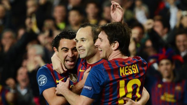 Xavi, Iniesta and Lionel Messi during a 2012 Champions League quarter-final against Milan. Photograph: Jasper Juinen/Getty