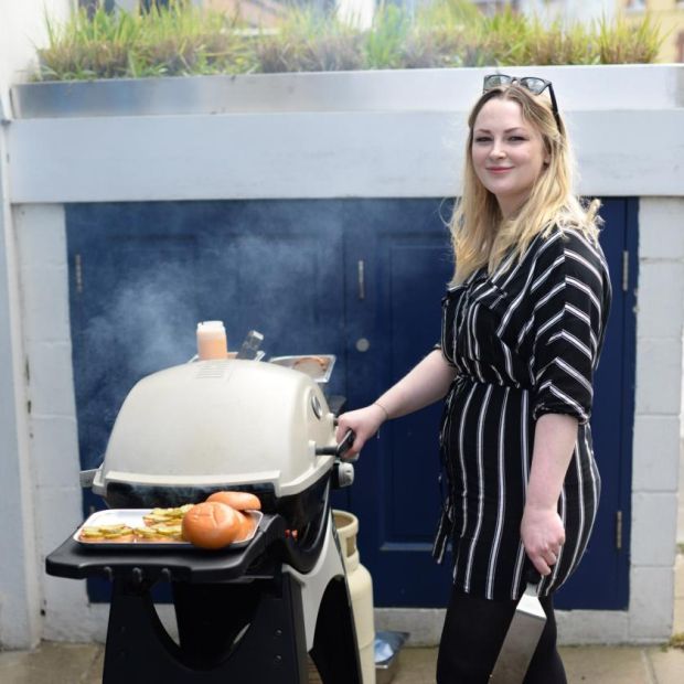 Grainne O'Keefe cooking her ultimate beef burgers on a barbecue outside BuJo, in Sandymount, Dublin. Photograph: Dara Mac Dónaill/The Irish Times