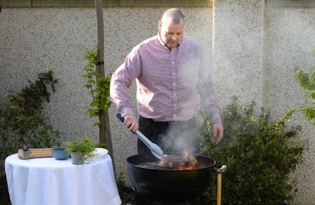 Gaz Smith cooking T-bone steak over a barbecue. Photograph: Dara Mac Dónaill/The Irish Times
