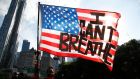 I can’t breathe: a protester in Manhattan. Photograph: Jason Szenes/EPA
