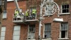 Workers treat a building in Dublin city. File photograph: Cyril Byrne