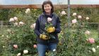  Susan Lynch working on her roses which are still in flower in the polytunnel at her home in Oldtown, Co. Dublin. Photograph: Alan Betson