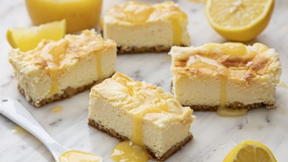 Lemon cheesecake bars with lemon curd drizzle. Photograph: Harry Weir Photography