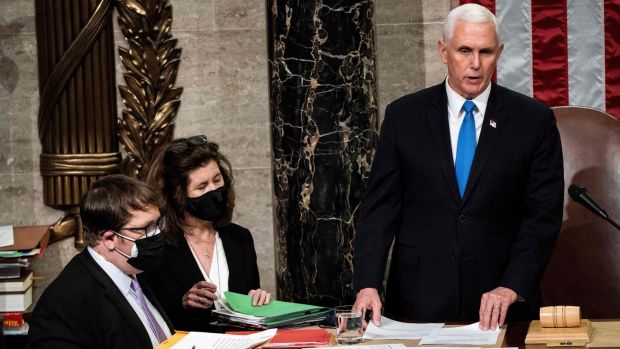 Mike Pence presides over a joint session of Congress to certify the 2020 electoral college results after supporters of President Donald Trump stormed the US Capitol earlier in the day. Photograph: Erin Schaff/POOL/AFP via Getty Images