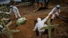 Workers bury someone who died with Covid-19, in the Nossa Senhora Aparecida public cemetery in Manaus, Amazonas, Brazil, last week. Photograph: Raphael Alves/EPA