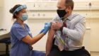 Northern Ireland’s Chief Medical Officer Michael McBride receives a dose of the Oxford/AstraZeneca coronavirus vaccine from nurse Alana McCaffery at the Ulster Hospital Covid-19 vaccination centre in Belfast. Photograph: PA 