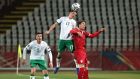 Republic of Ireland’s Josh Cullen jumps for the ball with Dusan Vlahovic of Serbia during Wednesday’s World Cup qualifying match in Belgrade. Photograph: Srdjan Stevanovic/Getty Images