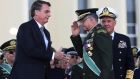 Brazilian president Jair Bolsonaro, left, has sought political gain by associating his administration with one of the country’s most respected institutions, filling his government with serving and retired officers. File photograph: Antonio Cruz/Agencia Brasil/EPA